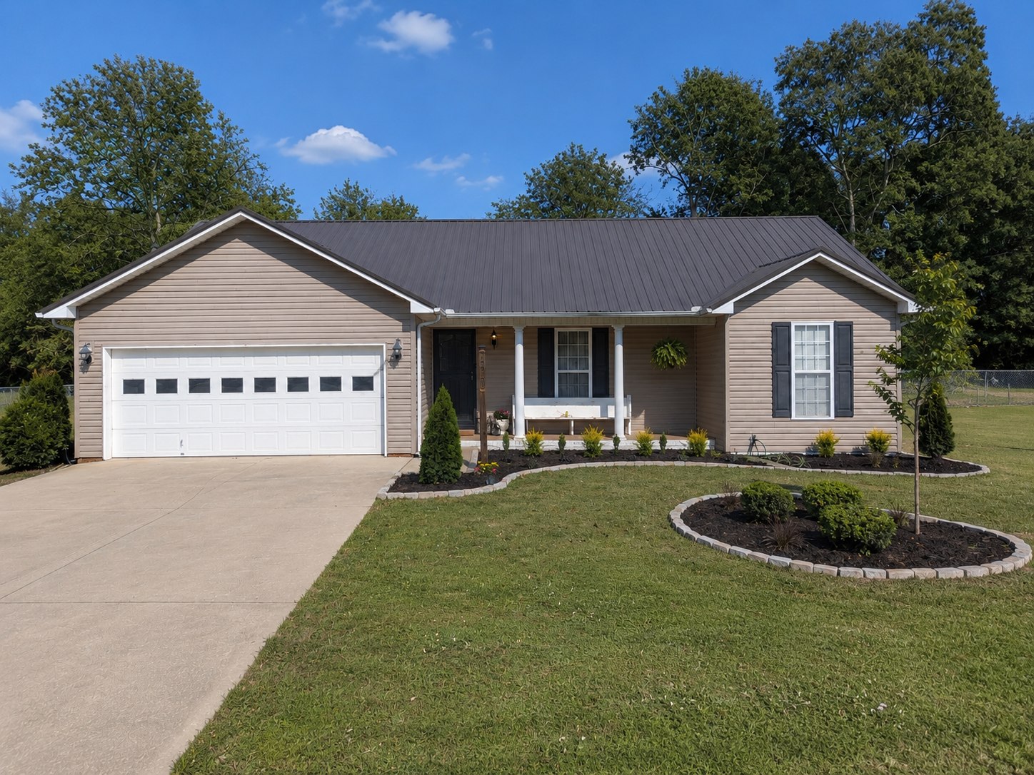 The same front yard after lawn and landscaping improvements